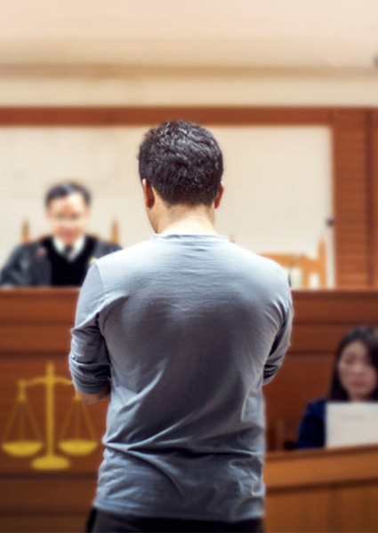 man shown appealing before the judge