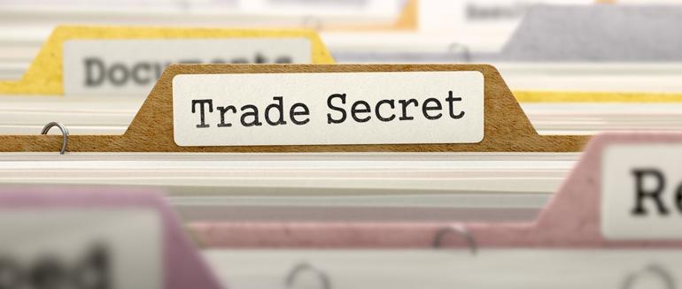 folder labeled trade secrets in a file cabinet